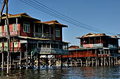 Inle Lake Myanmar. All the buildings are constructed on piles. Residents travel around by canoe, but there are also bamboo walkways and bridges over the canals, monasteries and stupas. 